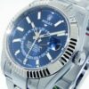 Réplica de qualidade Rolex Sky-dweller 42 mm ouro branco e aço azul mostrador e moldura canelada 326934